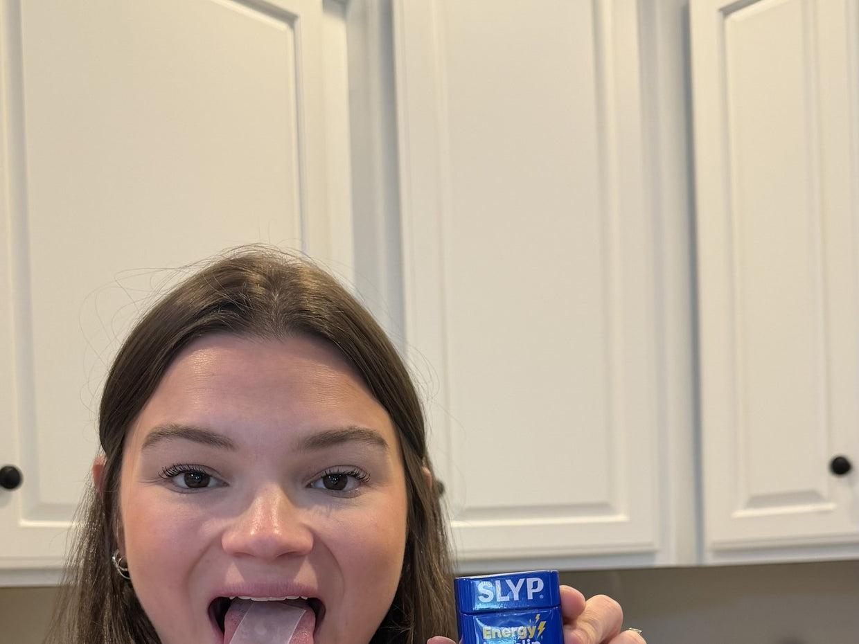 Slyp energy tin in hand on the go — clean boost anywhere